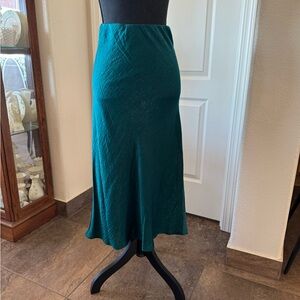 NWT size large cut on bias pretty silky green slip skirt.